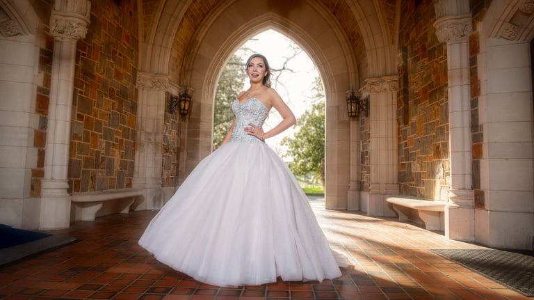 quinceanera in a white dress standing in a archway