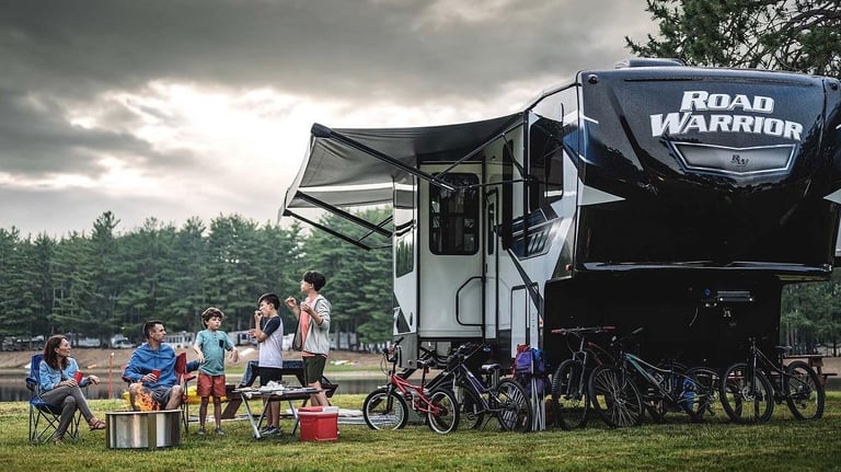 a group of people sitting around a campervan