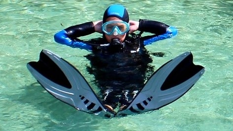 a person in a wetsuit and a scuba suit