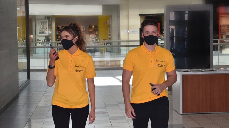 Two Security Guard inside the building inspecting the areas