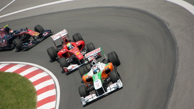 Three Formula 1 cars in turn 2 of the Canadian Grand Prix in 2012