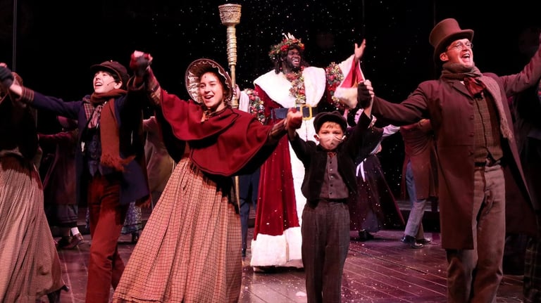 a group of people standing on a stage dancing