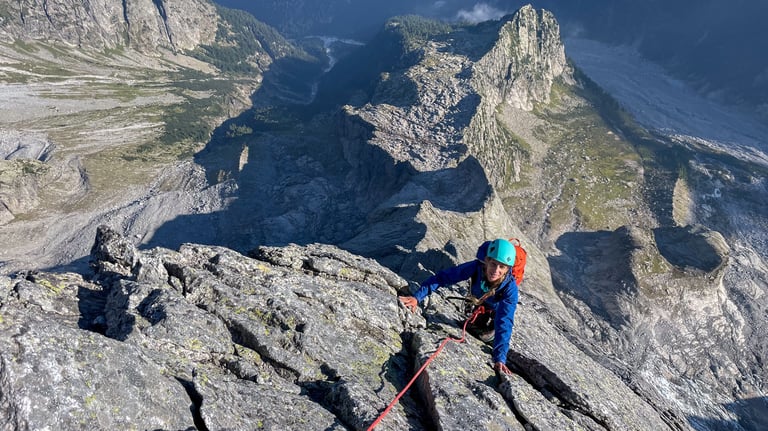 Climbing in the sun — High on the north ridge of Piz Badile.
