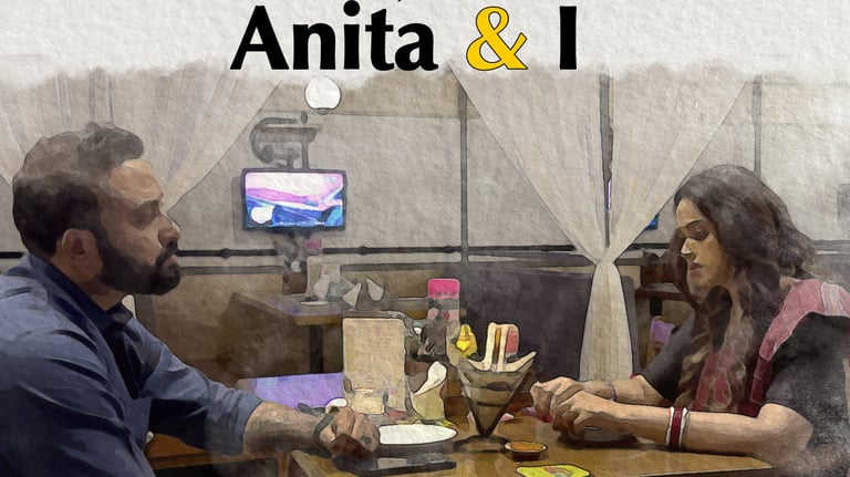 a man and woman sitting at a table with a man in a blue shirt