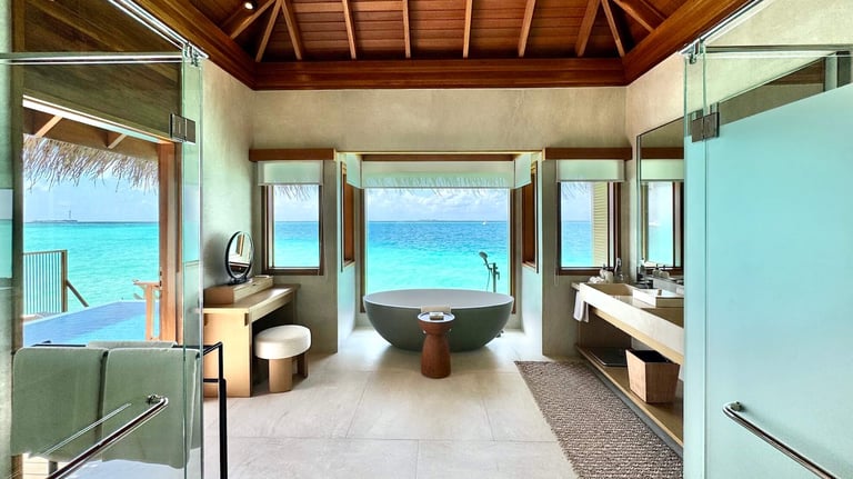 Huvafen Fushi Maldives lagoon bungalow with pool bathroom