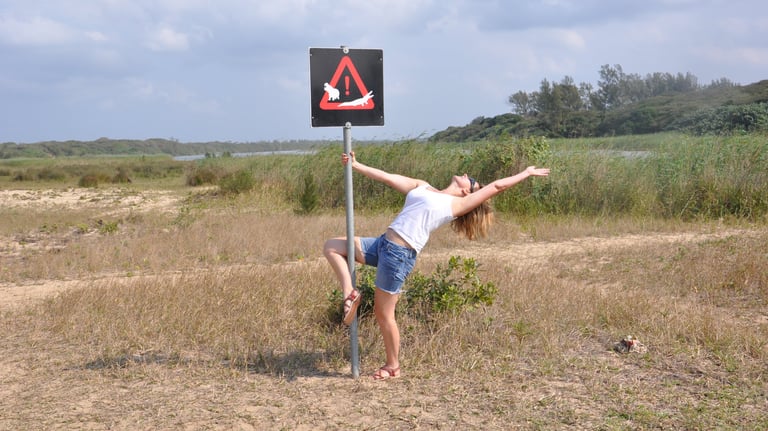 Tracey Billington showing off at estuary beach, St Lucia, South Africa
