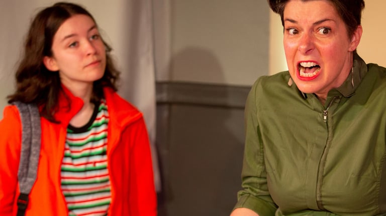 Preteen Lucy watches as her mother Johanna grimaces in frustration