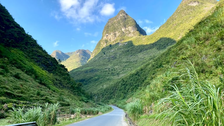 a road with a mountain view of a road