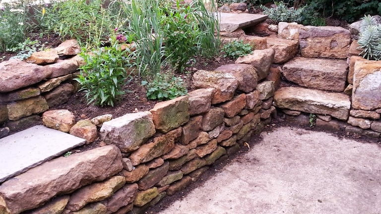 Natrural landscaping using local stone with a colourful natural planting scheme
