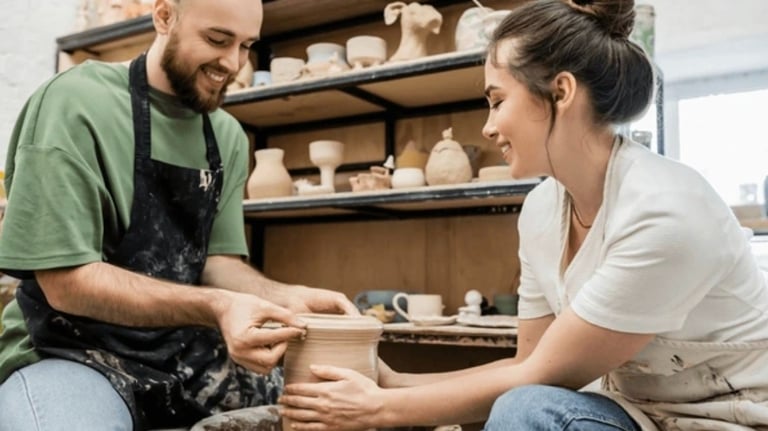 date night pottery fun, a couple making pottery