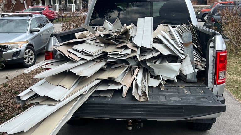 A truck bed filled with aluminum siding to be recycled 