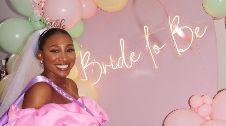 a black woman smiling at her bridal shower, event photography