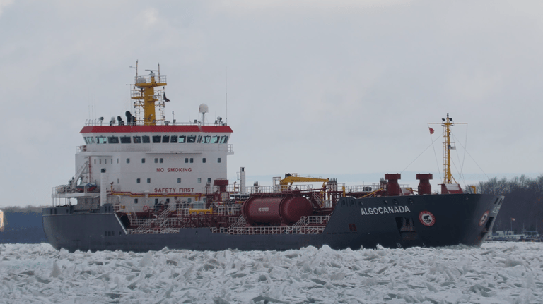 Tanker ship Algocanada navigating through heavy chunks of broken ice. Viewed from the front right side looking aft,