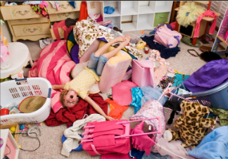 overwhelmed child in cluttered bedroom showing need for home decluttering