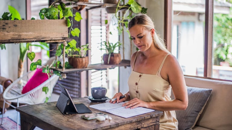 Woman working in a videocall in minimal living room 