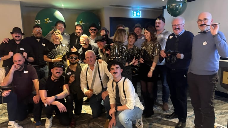 a group of corporate people enjoy a murder mystery party