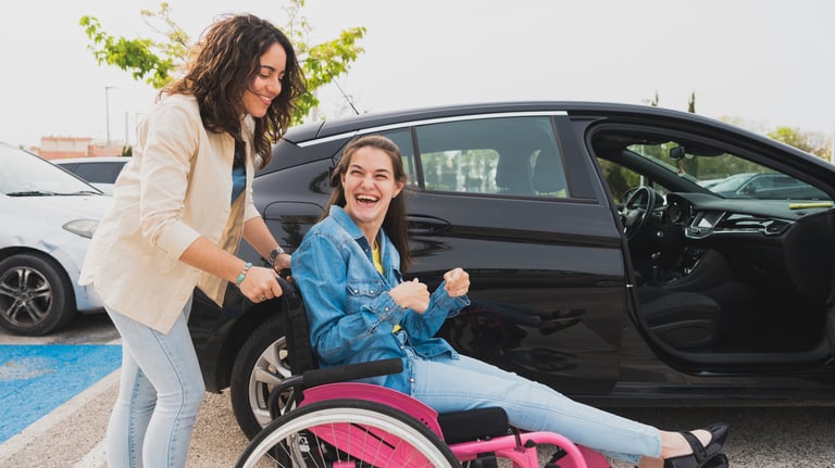 Support worker assisting participant with transport