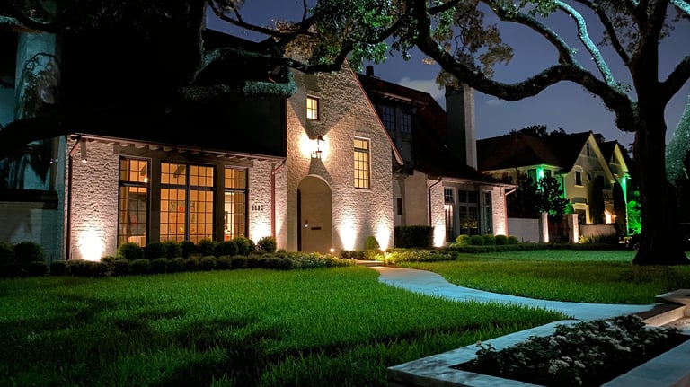 landscape lighting on front facade of house, tree up lighting and moon lighting