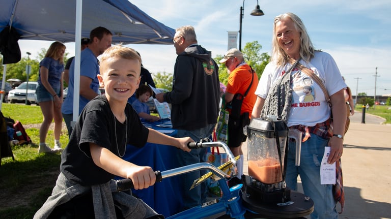 Young boy on our blender bike powering a smoothie!