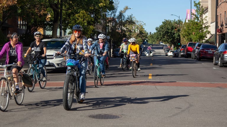 Large group of people biking downtown