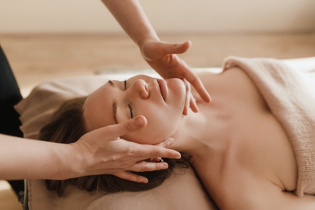 a woman getting a massage at a spa