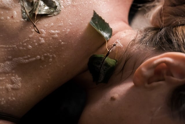 a woman is laying on a massage table