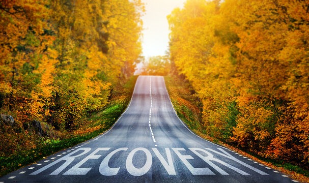 a road with a road sign that says recovery