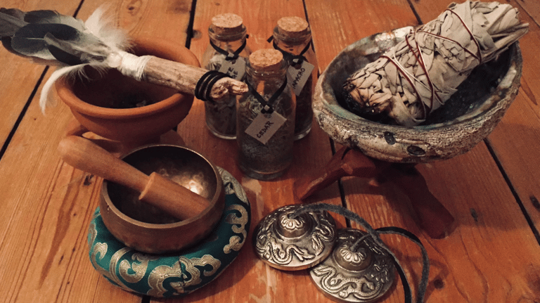 a table with a bowl of incense and a bowl of incense