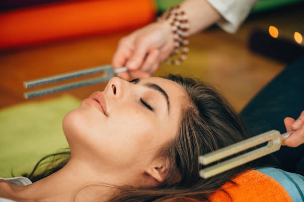 a woman getting her hair done by a hairdresser