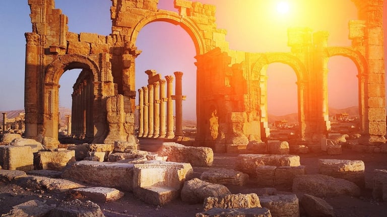 a large arch in a desert landscape with a bright sun shining through the arches
