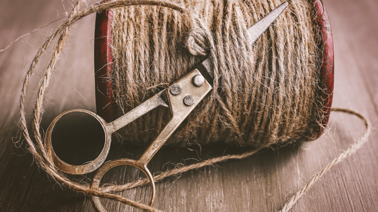 a pair of scissors and a spool of twine twine twine twin