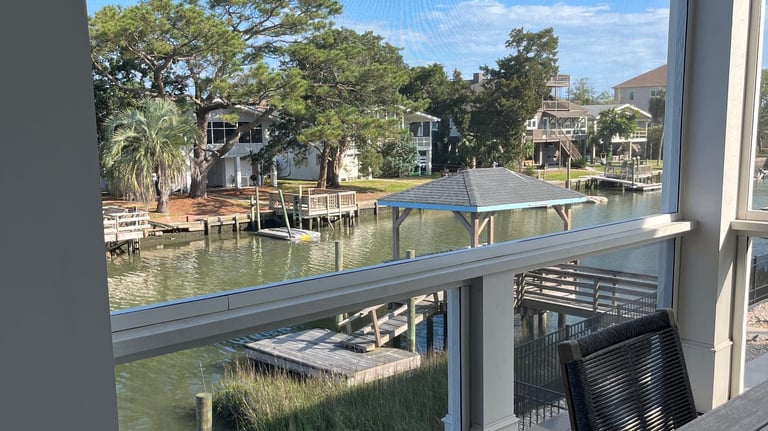 A beautiful view from a screen porch on the creek.