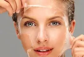 a woman with a clear plastic face mask on her face