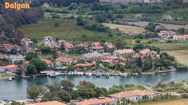a small town with a river and a boat in the water