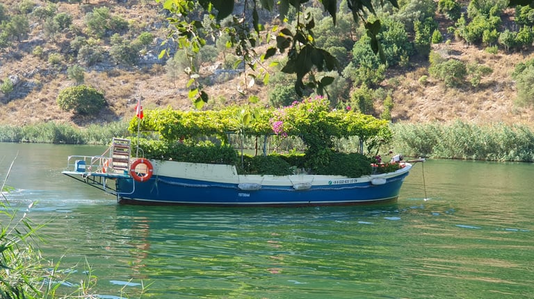 a boat covered with flowers in Dalyan River, one of the best places to visit in Dalyan