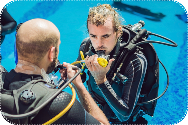 a man in a scuba suit is holding a scuba suit