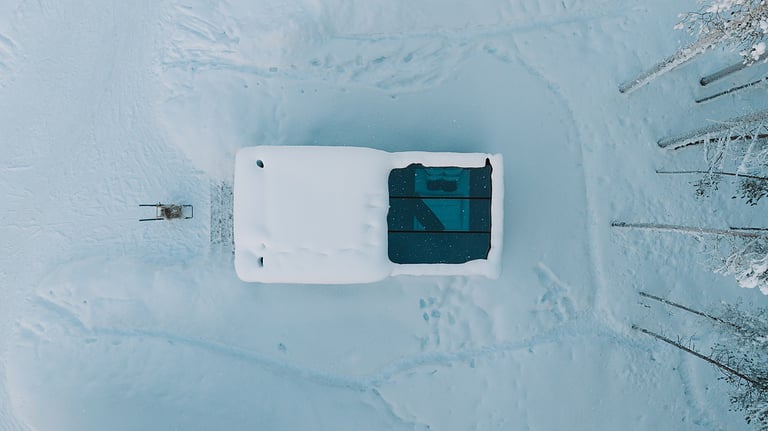 Aerial view of Lapland resort in snowy environment with surrounding nature