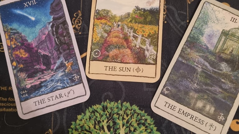 3 tarot cards the star, the sun, the empress