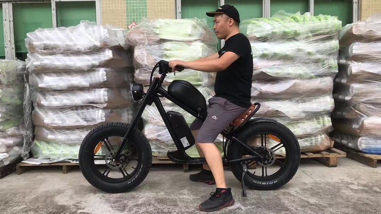 a man riding a motorcycle with a large amount of plastic bags