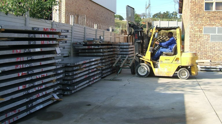 Granite slabs ready to be moved to production by an operator
