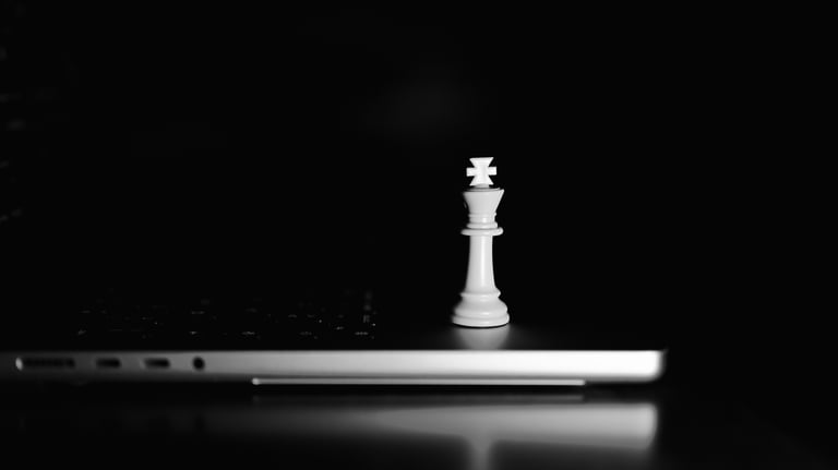 a closed laptop with a chess piece on the lid