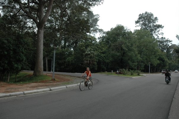 `Tracey Billington cycling at the Temples of Angkor, Siem Reap, Cambodia