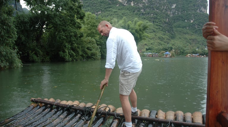 Nick Billington driving the raft at the Yulonghe scenic area, near Yangsh