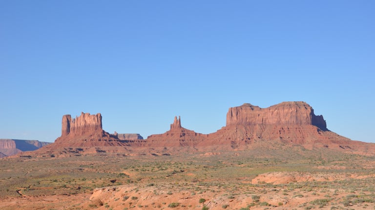 canyonlands national park in the desert with a blue sky
