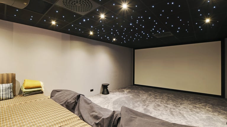 Private cinema room at Villa Bastille with full-width screen