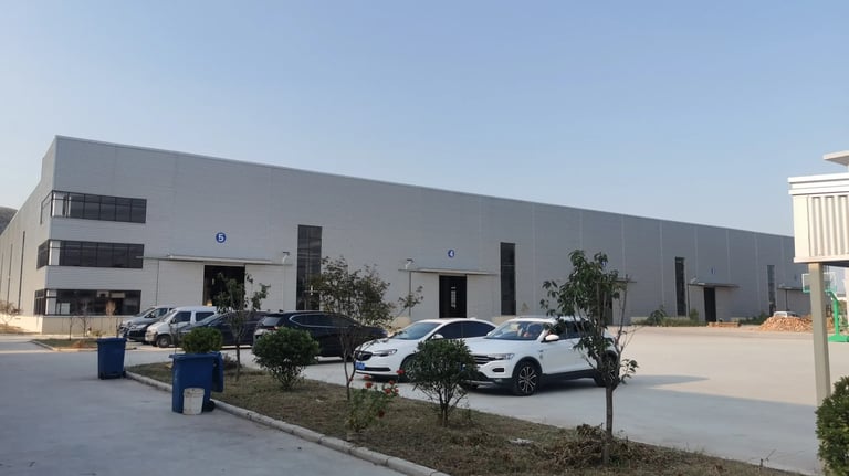View our Zorylift loader crane plant: a large production facility with dedicated loading bays for seamless global shipping.