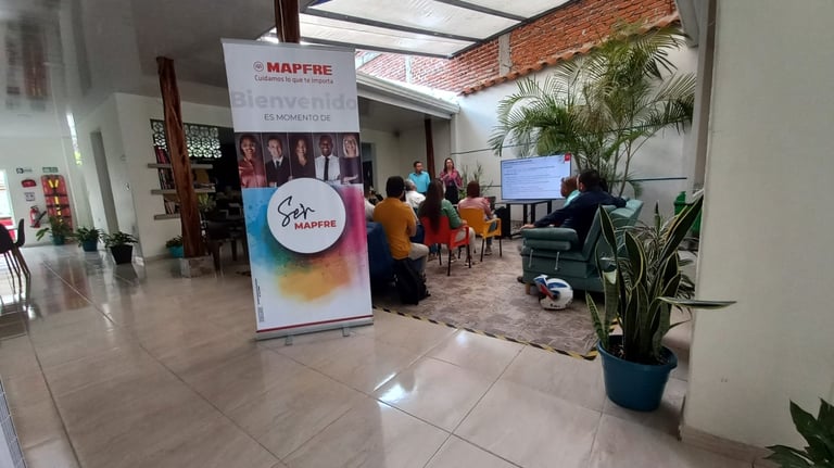 a group of people sitting at tables in a lobby