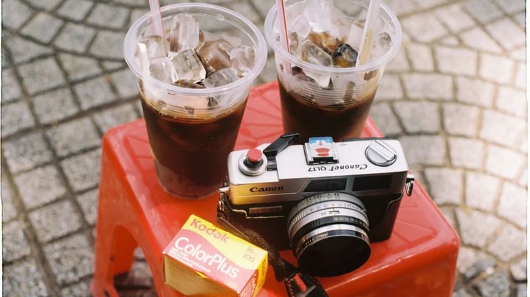 a camera and a film with two drinks