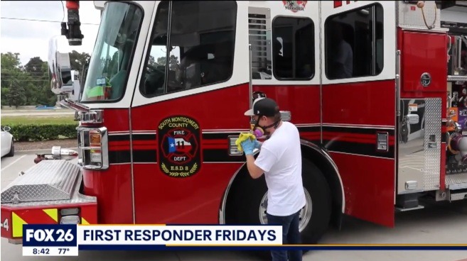 Technician cleaning fire truck
