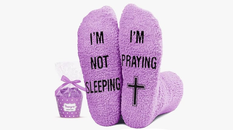 Picture of bottom of socks that says NOT Sleeping but Praying.